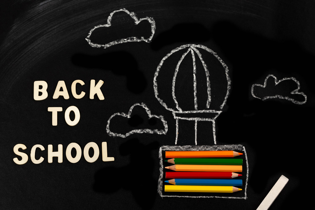 Back to school background with air balloon and pencils Back to school background with air balloon and pencils
