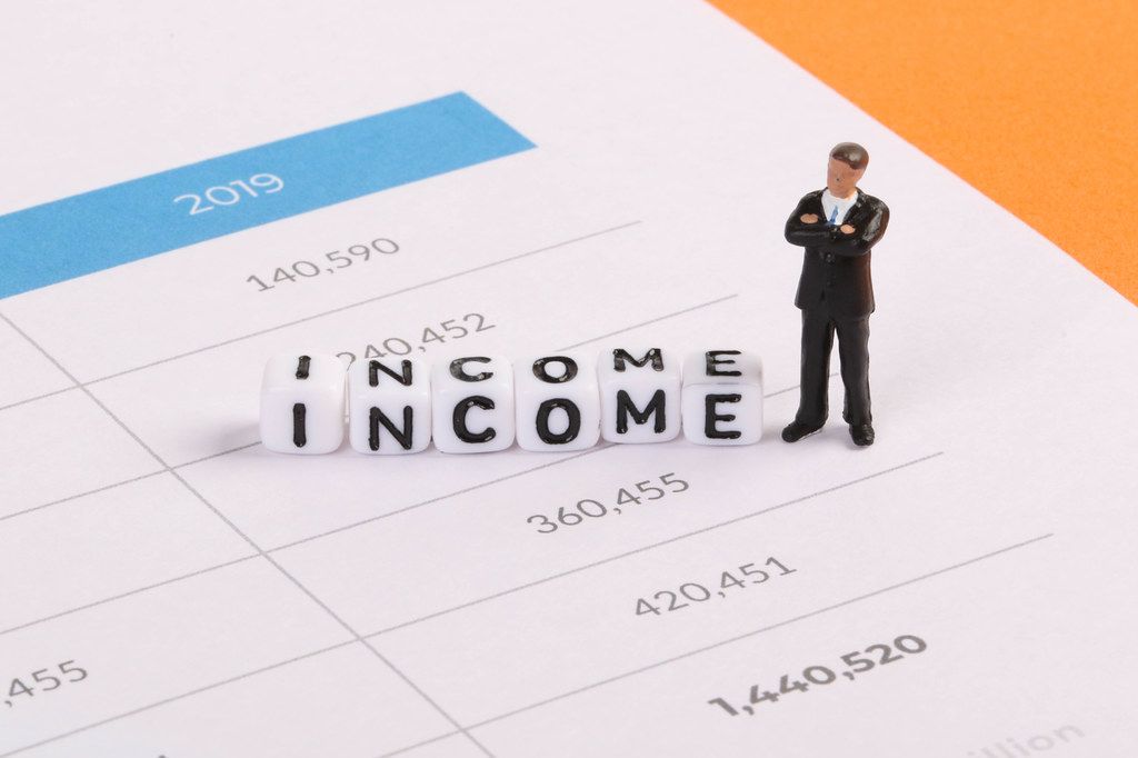 Businessman figure with Income text Businessman figure with Income text
