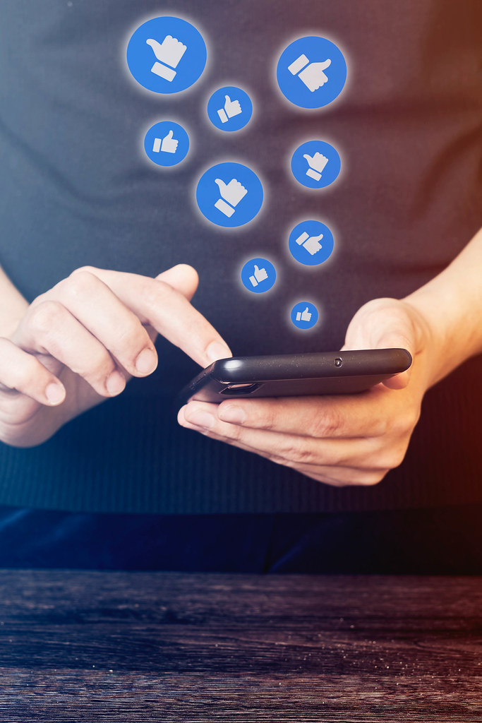 Close-up view of a woman using social media network on mobile phone Close-up view of a woman using social media network on mobile phone