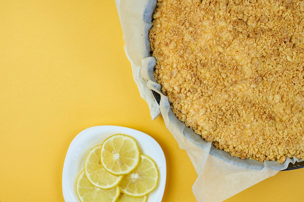 Freshly cooked cottage cheese pie on yellow Freshly cooked cottage cheese pie on yellow