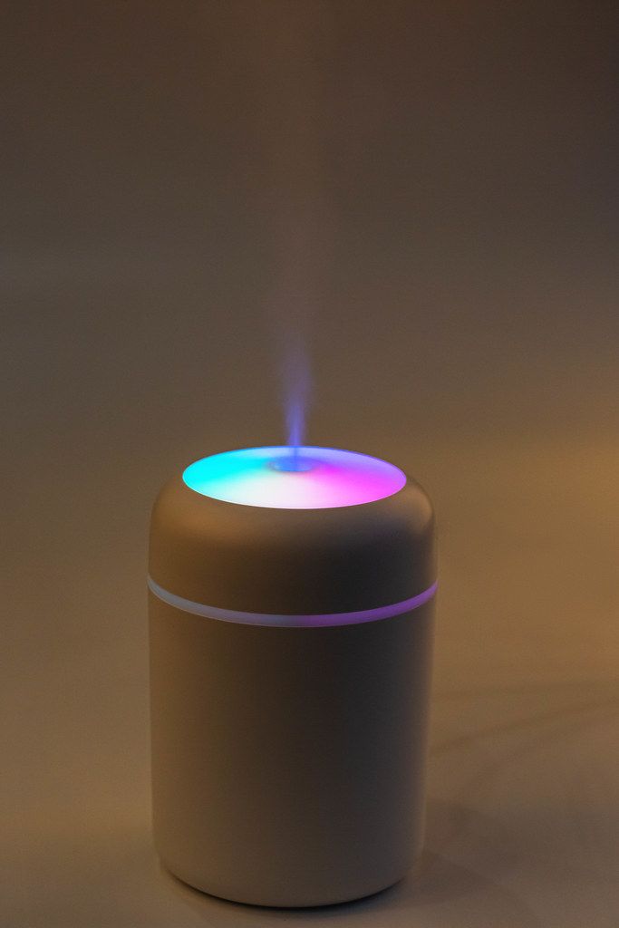 Modern air humidifier with multi-colored lighting Modern air humidifier with multi-colored lighting