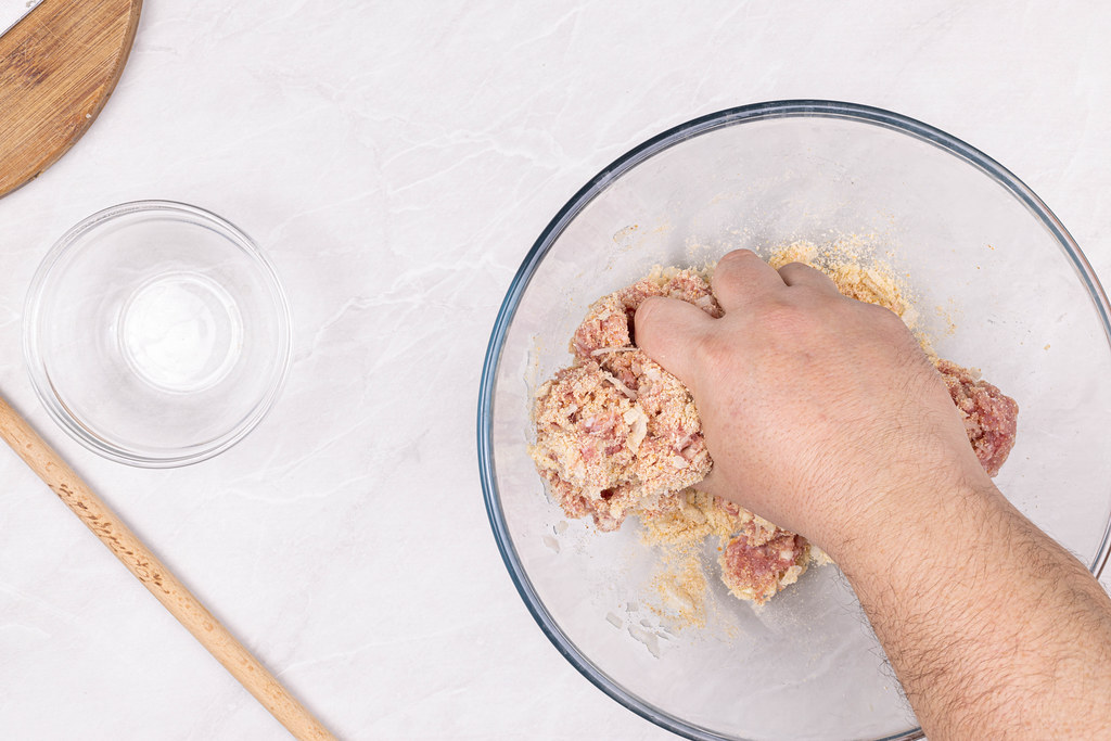 Preparing Meat Balls with minced meat onion and bread crumbs with hand Preparing Meat Balls with minced meat onion and bread crumbs with hand