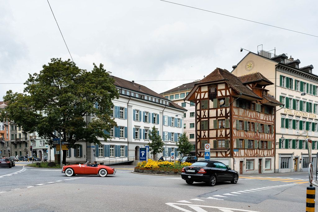 Retro car looking harmoniously in historic center of Lucerne, Switzerland Retro car looking harmoniously in historic center of Lucerne, Switzerland