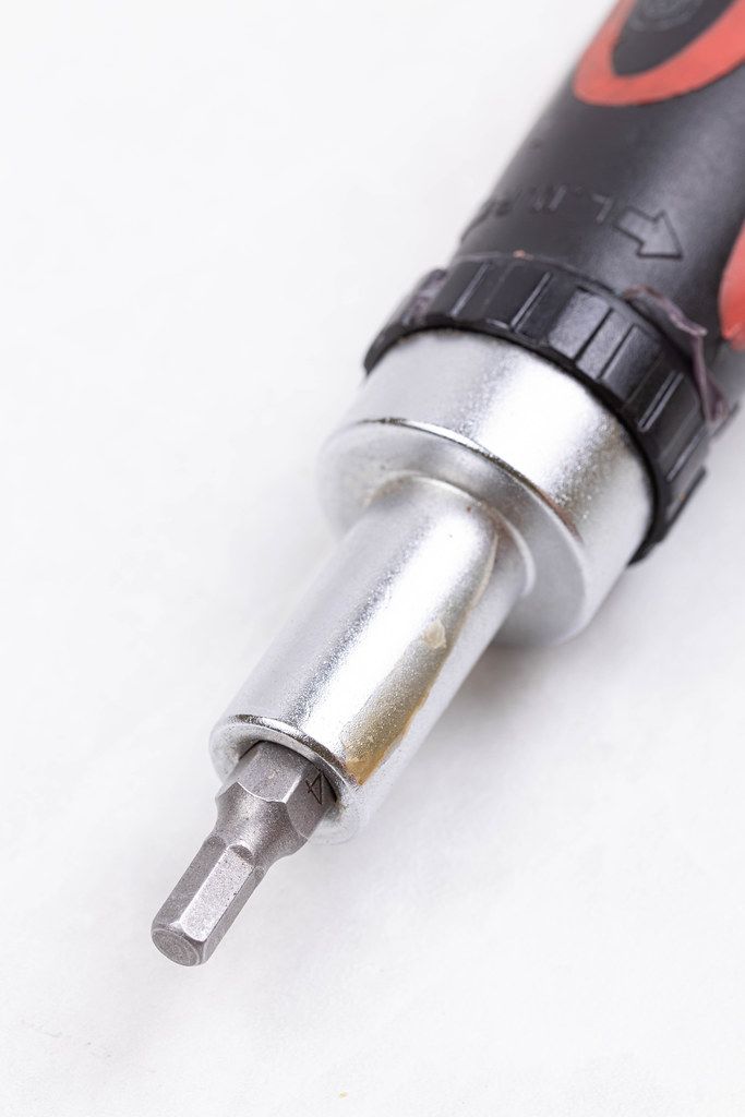 Screwdriver with Hex bit isolated above white background Screwdriver with Hex bit isolated above white background