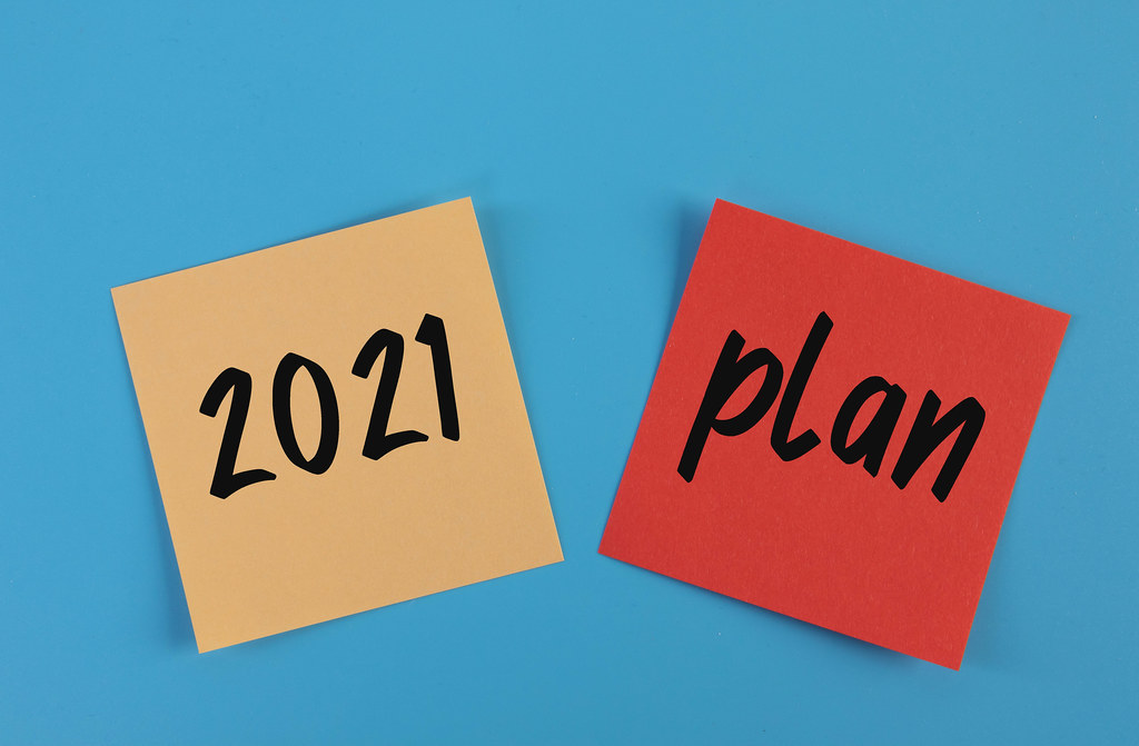 Sticky notes with 2021 Plan text on blue background Sticky notes with 2021 Plan text on blue background