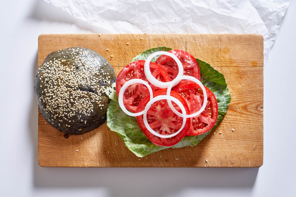 Tasty homemade hamburger on the cutting board Tasty homemade hamburger on the cutting board