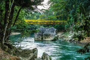 A Yellow Bridge Overpassing the Cahabon River A Yellow Bridge Overpassing the Cahabon River