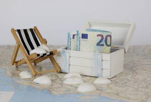 Close Up Photo of Wooden Chest Box with Euro Banknote, Beach Chair and Shells on a Map Close Up Photo of Wooden Chest Box with Euro Banknote, Beach Chair and Shells on a Map