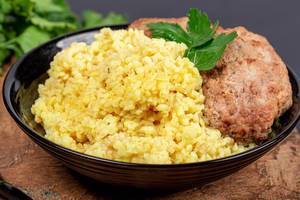 Close- up , wheat porridge with cutlets Close- up , wheat porridge with cutlets