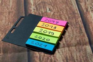 Colorful notes with years written on Colorful notes with years written on