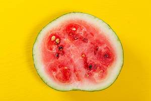 Cut watermelon on a yellow background Cut watermelon on a yellow background
