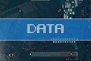 Data text over electronic circuit board background