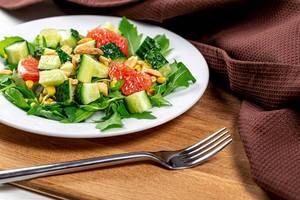 Diet salad with vegetables, grapefruit and nuts Diet salad with vegetables, grapefruit and nuts