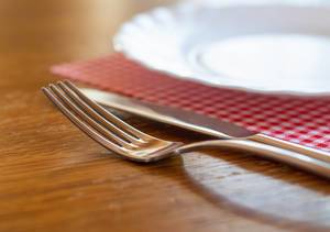 Empty plate with knife and fork Empty plate with knife and fork