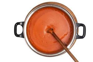 Flat lay above fresh domestic homemade tomato sauce isolated over white background Flat lay above fresh domestic homemade tomato sauce isolated over white background