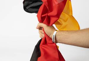 German football fan holding Germany flag German football fan holding Germany flag
