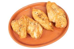 Grilled Chicken breasts served on the plate above white background Grilled Chicken breasts served on the plate above white background