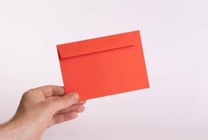 Hand holding red envelope Hand holding red envelope