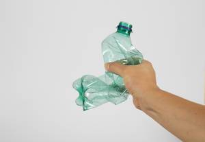 Hand squash a plastic bottle Hand squash a plastic bottle