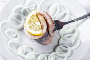 Herring marinated fillet with onion and lemon Herring marinated fillet with onion and lemon