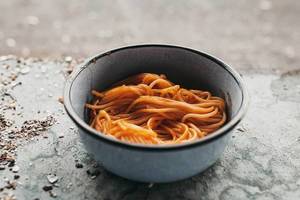 Homemade spaghetti in a vintage plate. Outdoor dinner Homemade spaghetti in a vintage plate. Outdoor dinner