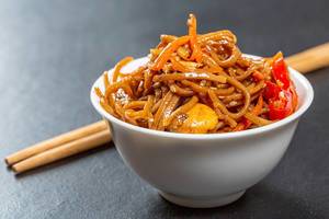 Macro shot of japanese soba with vegetables in sweet and sour sauce Macro shot of japanese soba with vegetables in sweet and sour sauce