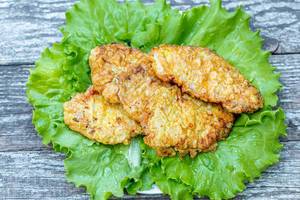 Meat chops fried in batter with lettuce leaves Meat chops fried in batter with lettuce leaves