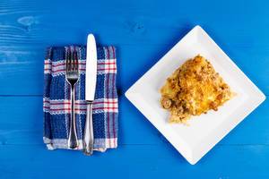 Minced Meat and Potatoes homemade pie on the square plate Minced Meat and Potatoes homemade pie on the square plate