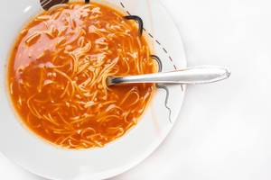 Overview of domestic Tomato Soup served in the plate Overview of domestic Tomato Soup served in the plate
