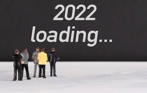People standing in front of 2022 loading text People standing in front of 2022 loading text