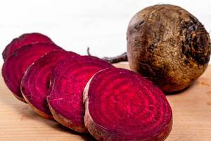 Pieces of chopped beet and whole beet on white background Pieces of chopped beet and whole beet on white background