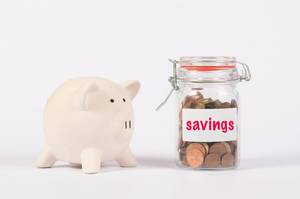 Piggy bank and money jar with savings text Piggy bank and money jar with savings text