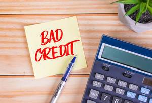 Red bad credit text on a sticky note Red bad credit text on a sticky note