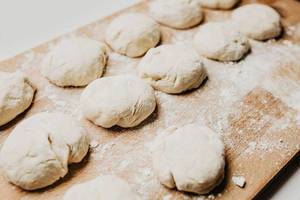 Set of raw dough rolls on wooden board. Set of raw dough rolls on wooden board.
