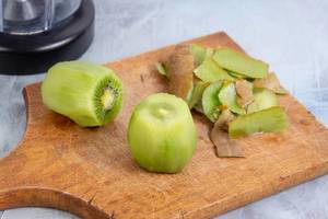 Sliced Kiwi fruit prepared for juice mixer