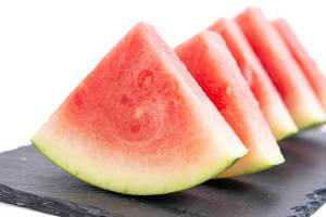 Sliced Watermelon on the black stone tray