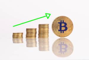 Stack of gold coins with arrow and golden Bitcoin Stack of gold coins with arrow and golden Bitcoin