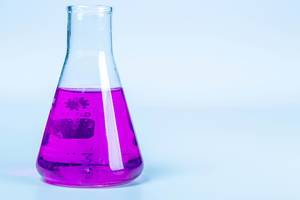 Test flask with purple liquid on light background Test flask with purple liquid on light background