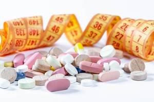 The concept of weight loss using medication pills The concept of weight loss using medication pills