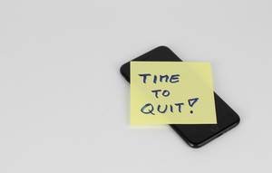 Time to quit written on paper note Time to quit written on paper note