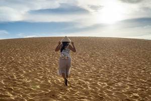 Woman with Vietnamese Hat in the Red Sand Dunes in Mui Ne, Vietnam Flip 2019 Woman with Vietnamese Hat in the Red Sand Dunes in Mui Ne, Vietnam Flip 2019