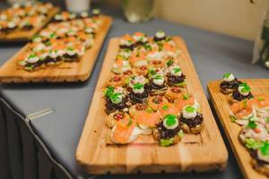 Wood Plates Of Salmon, Pork and Cream Canapes Wood Plates Of Salmon, Pork and Cream Canapes