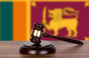 Wooden gavel and flag of Sri Lanka Wooden gavel and flag of Sri Lanka